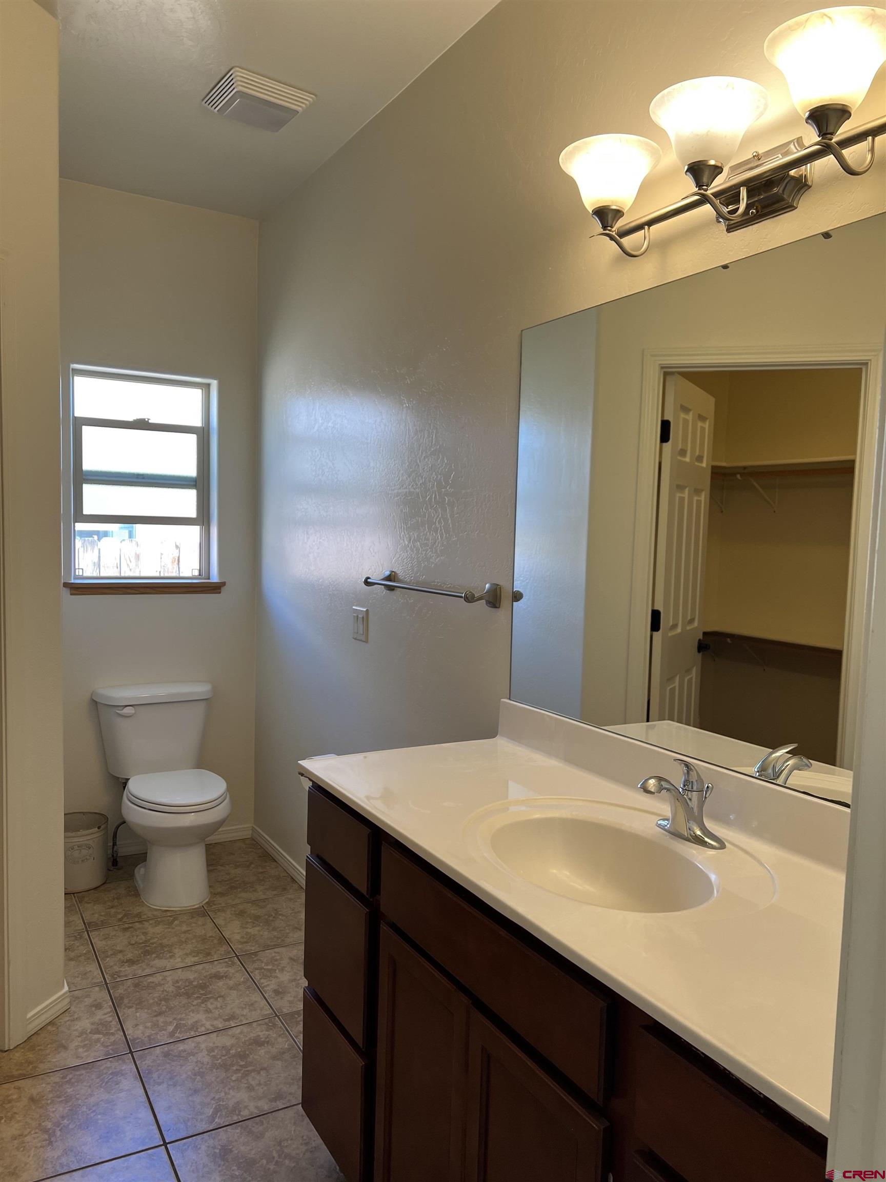 802 L Way Cortez, CO 81321 - Photo 12 of 21 a bathroom with a sink and a toilet