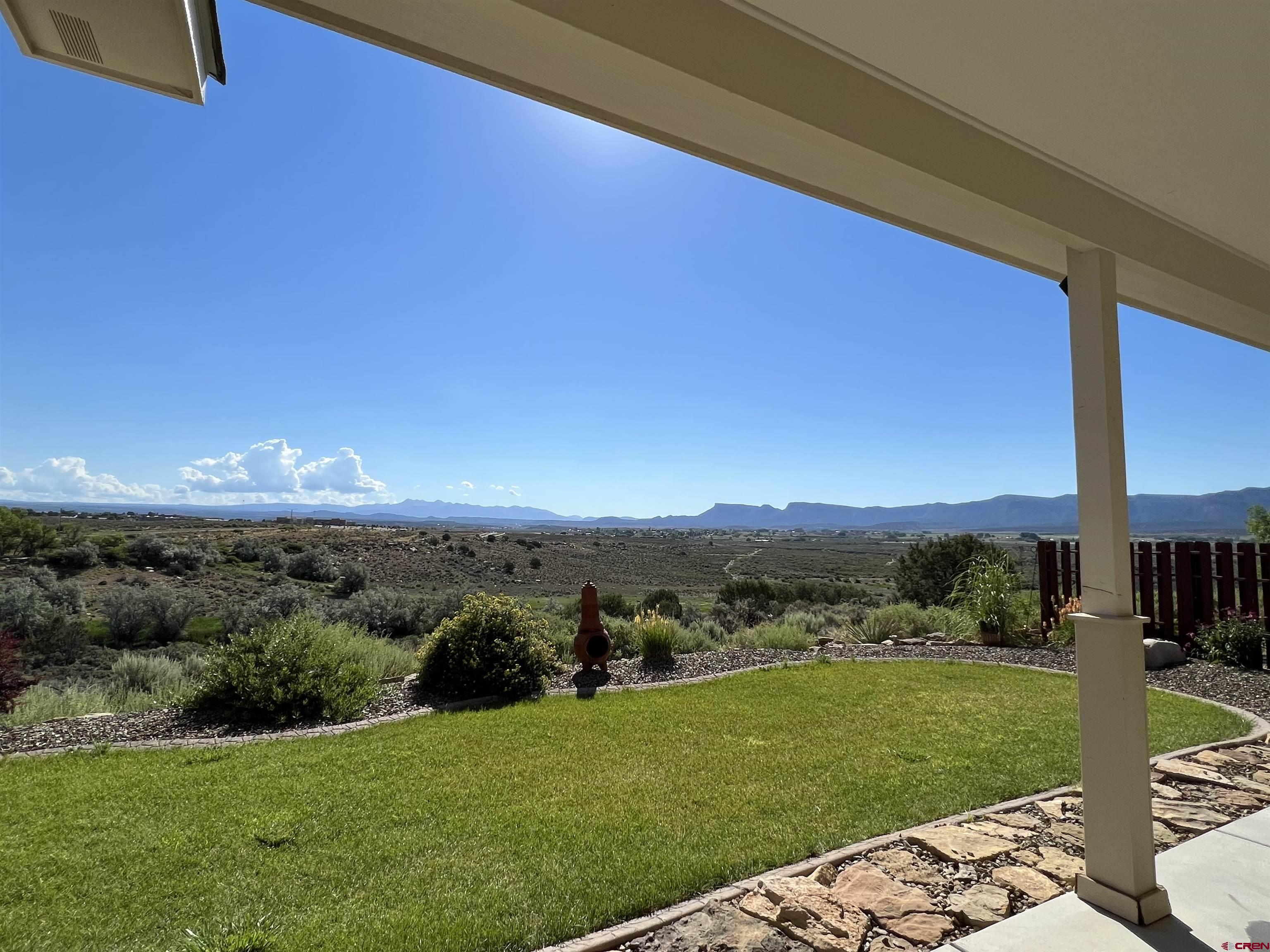802 L Way Cortez, CO 81321 - Photo 13 of 21 a view of a garden with mountains