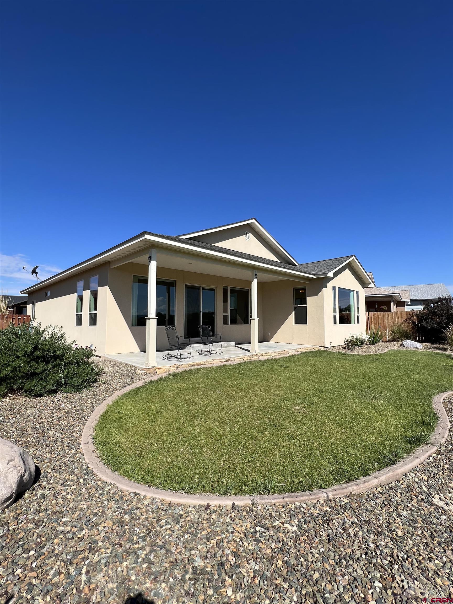 802 L Way Cortez, CO 81321 - Photo 17 of 21 a view of a house with a yard