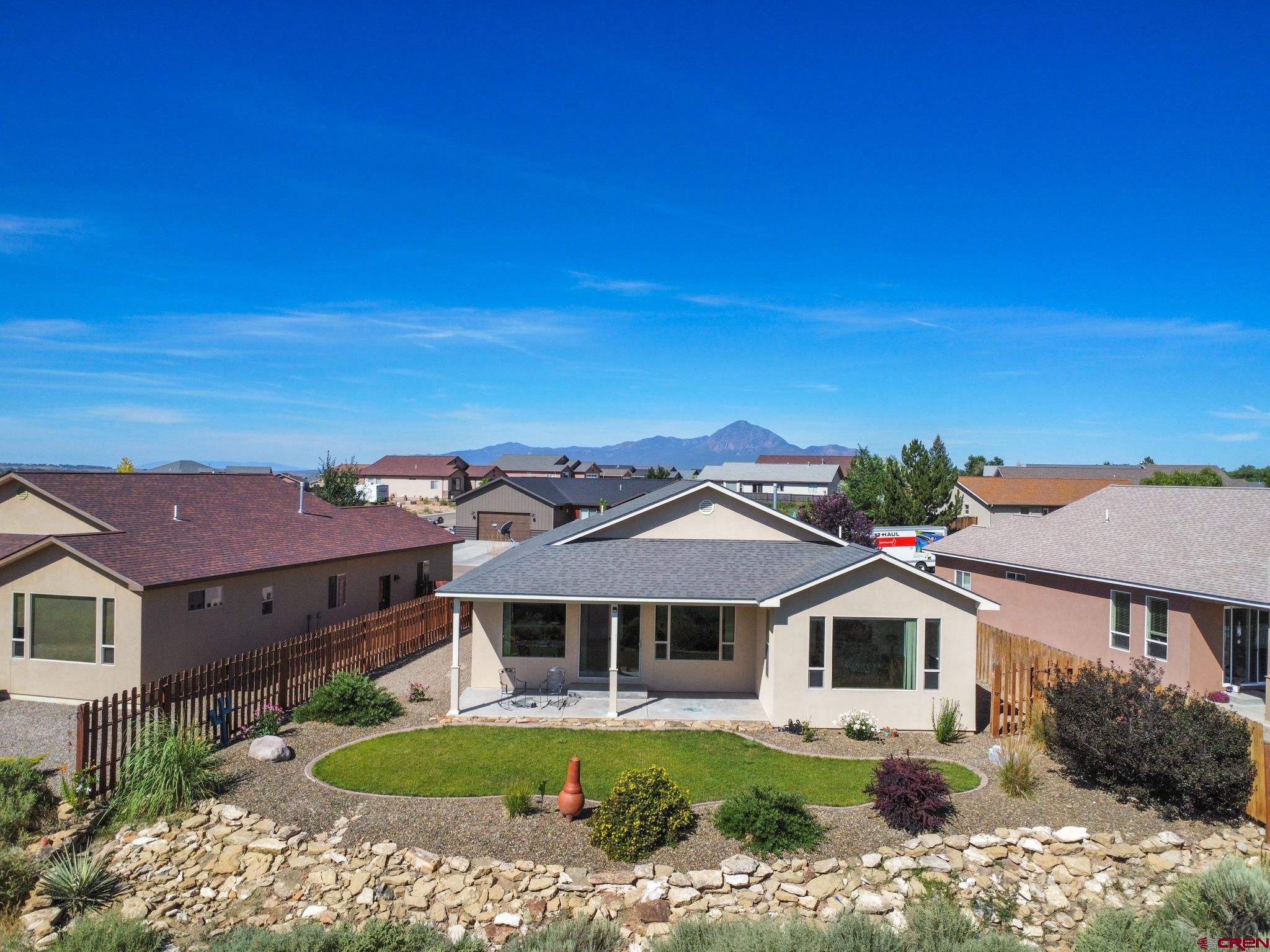 802 L Way Cortez, CO 81321 - Photo 19 of 21 a front view of a house with a yard