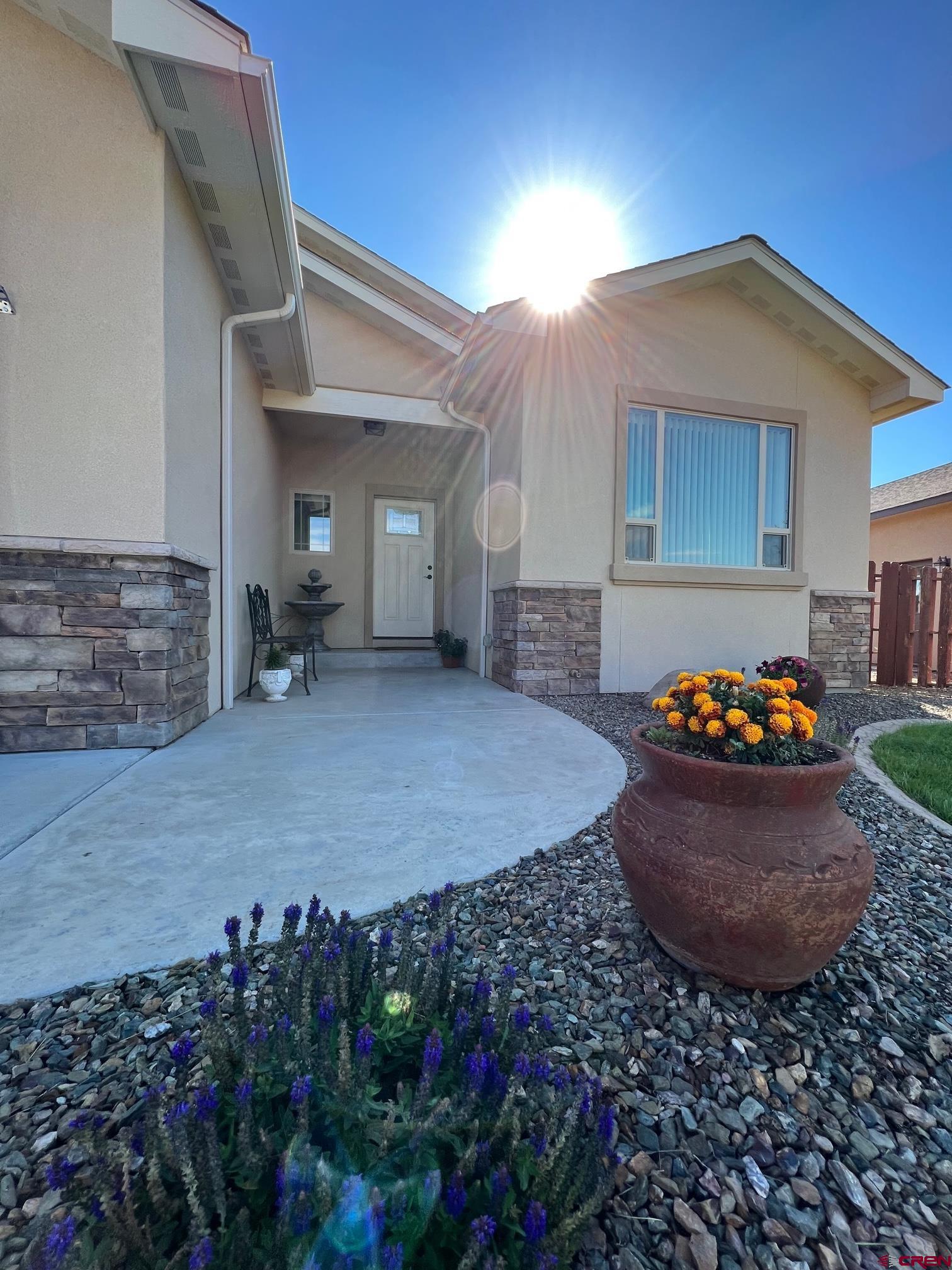 802 L Way Cortez, CO 81321 - Photo 3 of 21 a view of a backyard with plants and outdoor seating