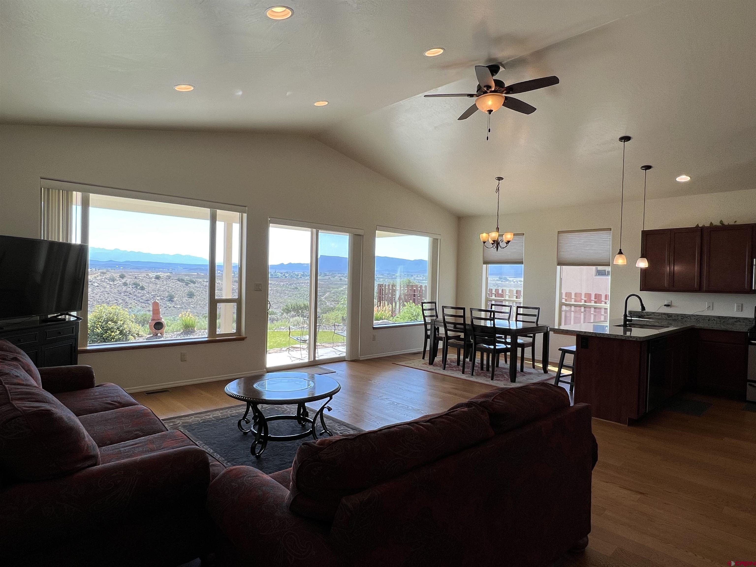 802 L Way Cortez, CO 81321 - Photo 6 of 21 a living room with furniture and a large window