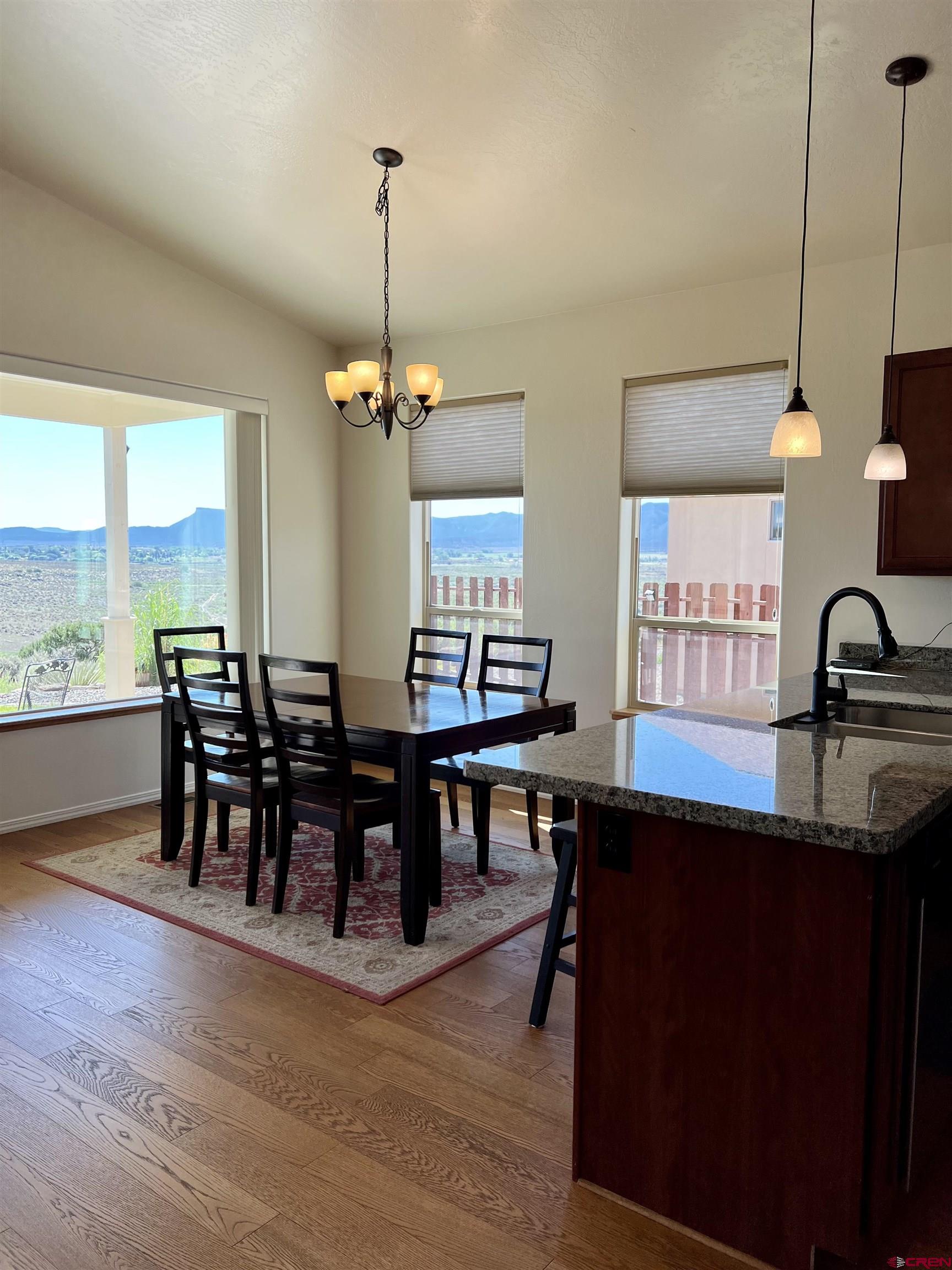 802 L Way Cortez, CO 81321 - Photo 7 of 21 a view of a a dining room with furniture window and wooden floor