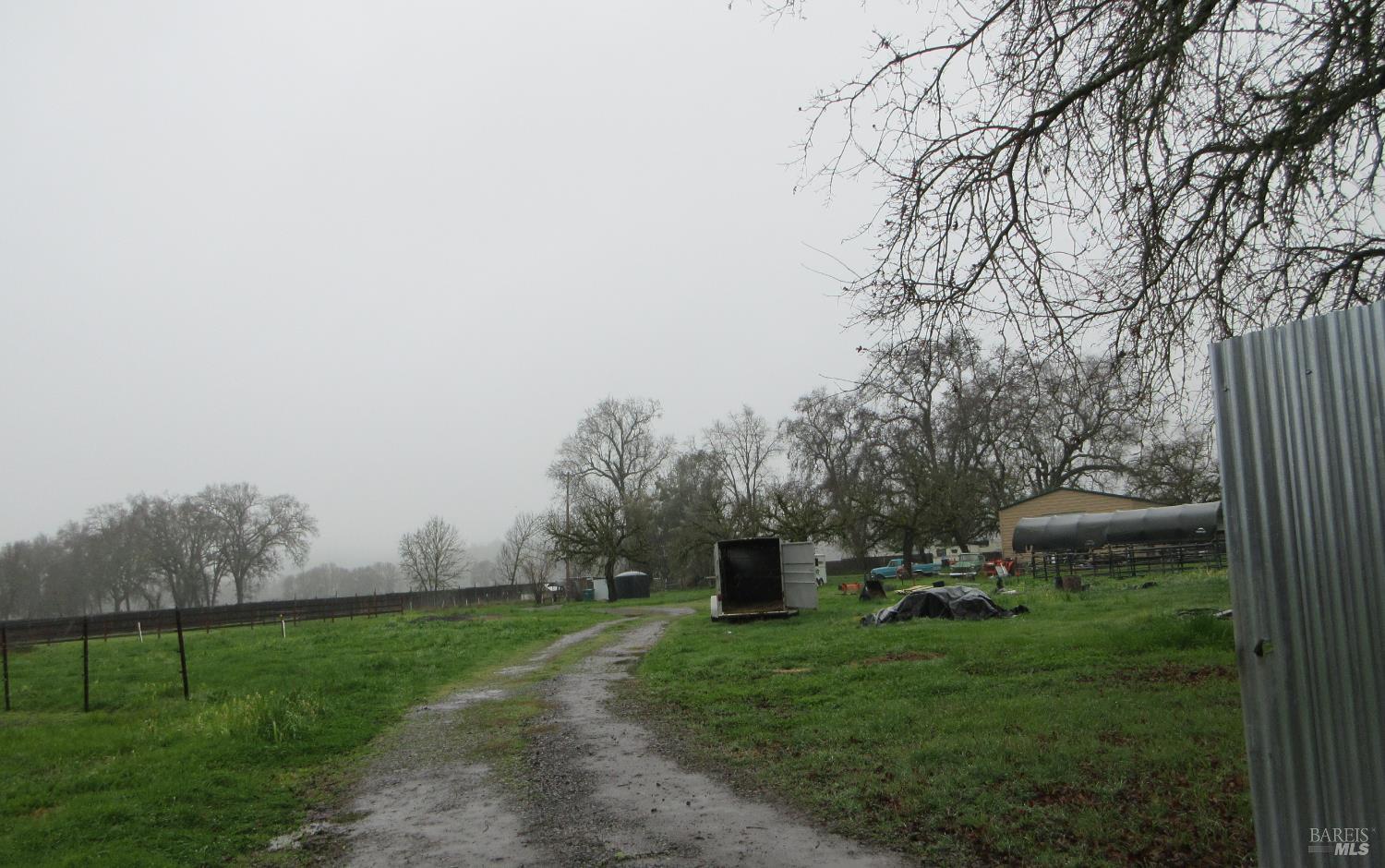 12562 Powerhouse Road Potter Valley, CA 95469 - Photo 1 of 1 a view of a grassy area with an trees