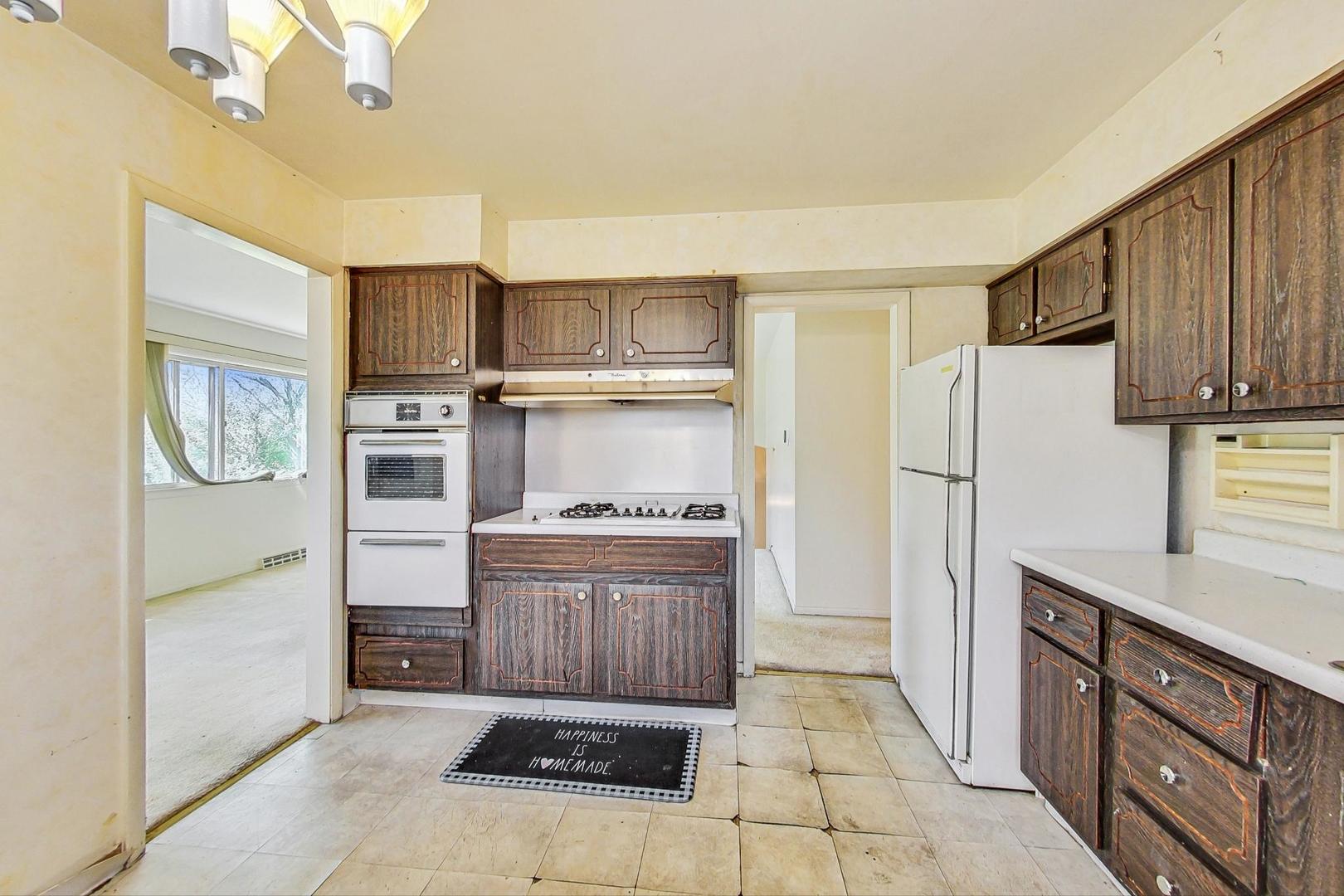 109 Mulberry Road Deerfield, IL 60015 - Photo 8 of 32 a kitchen with stainless steel appliances granite countertop a refrigerator a stove and a sink