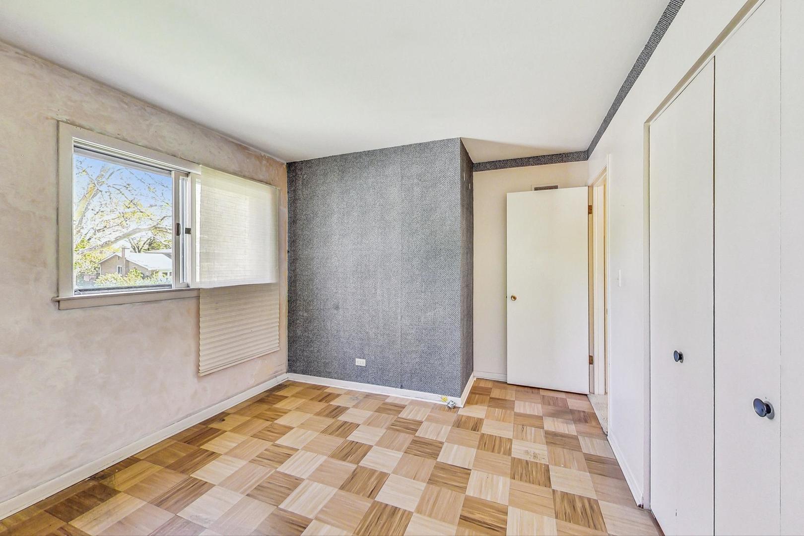 109 Mulberry Road Deerfield, IL 60015 - Photo 10 of 32 a view of a room with wooden floor and cabinet