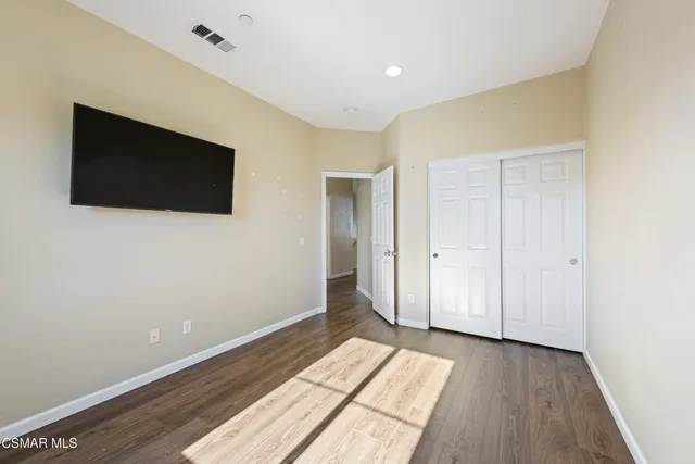 a view of a livingroom with wooden floor