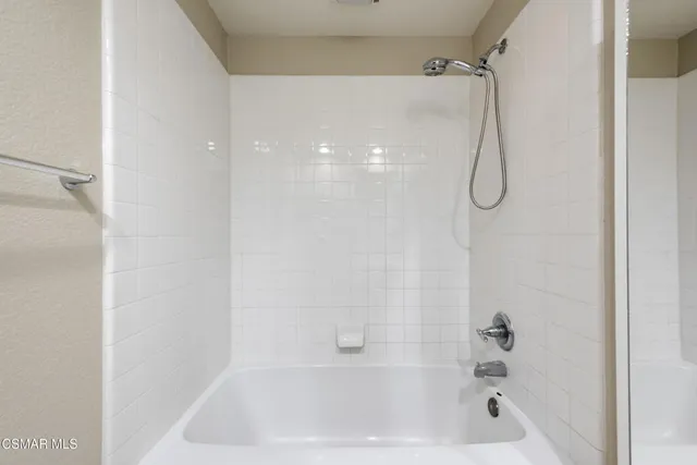 a close up of a bathtub in a bathroom