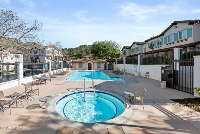 a view of a swimming pool with a patio