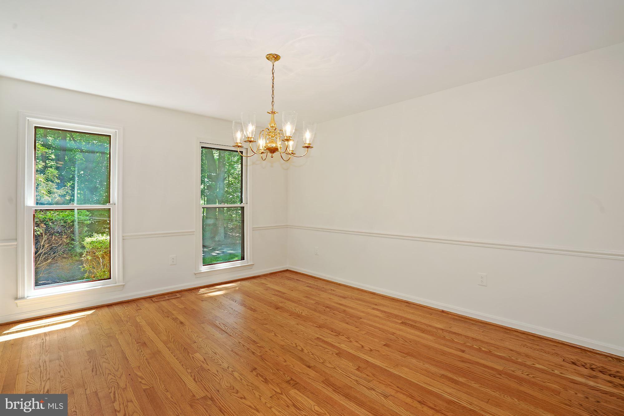 516 Springvale Road Great Falls, VA 22066 - Photo 16 of 44 Formal Dining Room with chair railing
