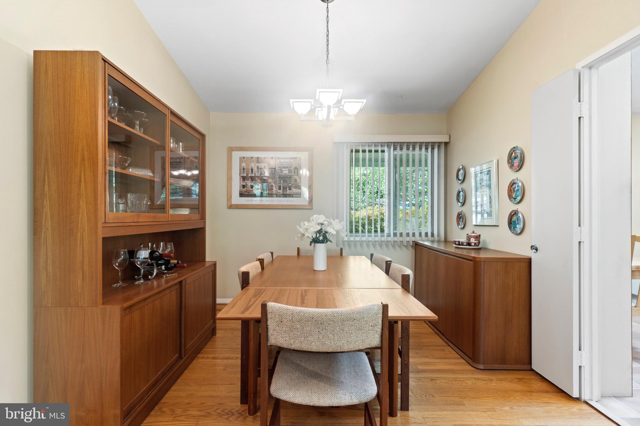 11318 Myrtle Lane Reston, VA 20191 - Photo 11 of 40 a dining room with wooden floor and furniture