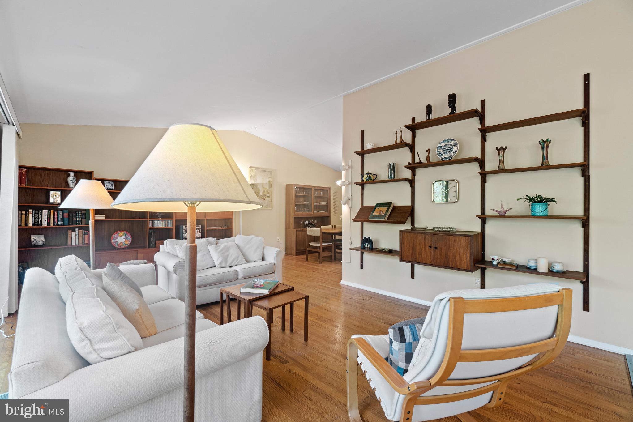 11318 Myrtle Lane Reston, VA 20191 - Photo 17 of 40 a living room with furniture a table and a lamp