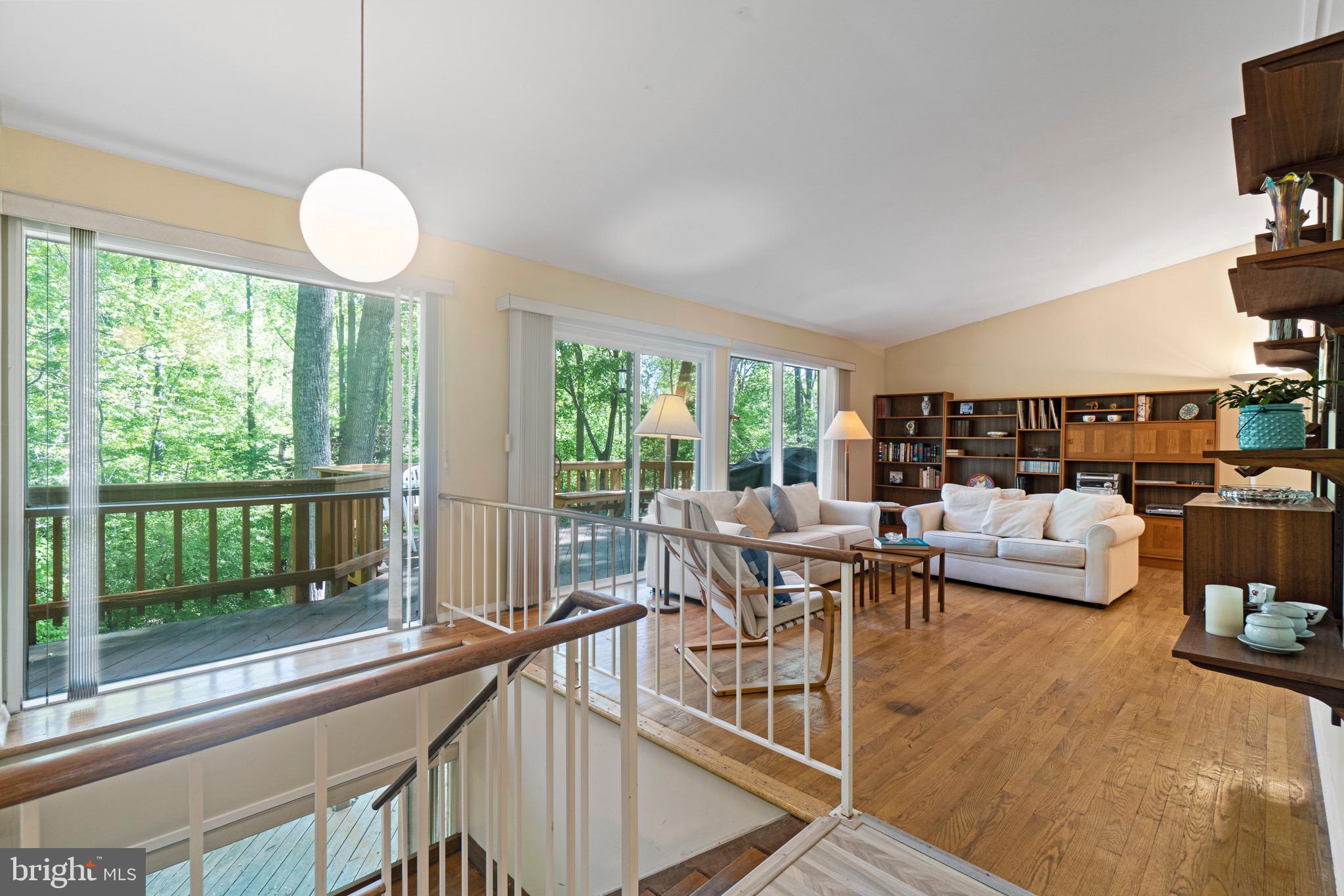 11318 Myrtle Lane Reston, VA 20191 - Photo 18 of 40 a very nice looking living room with a large window and a dining table with chairs