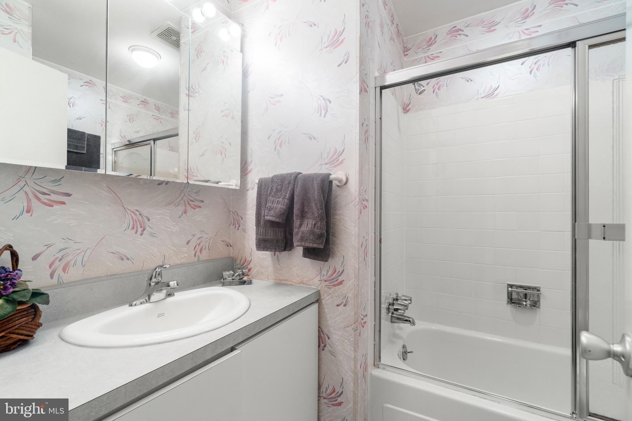 11318 Myrtle Lane Reston, VA 20191 - Photo 20 of 40 a bathroom with a sink a toilet and shower