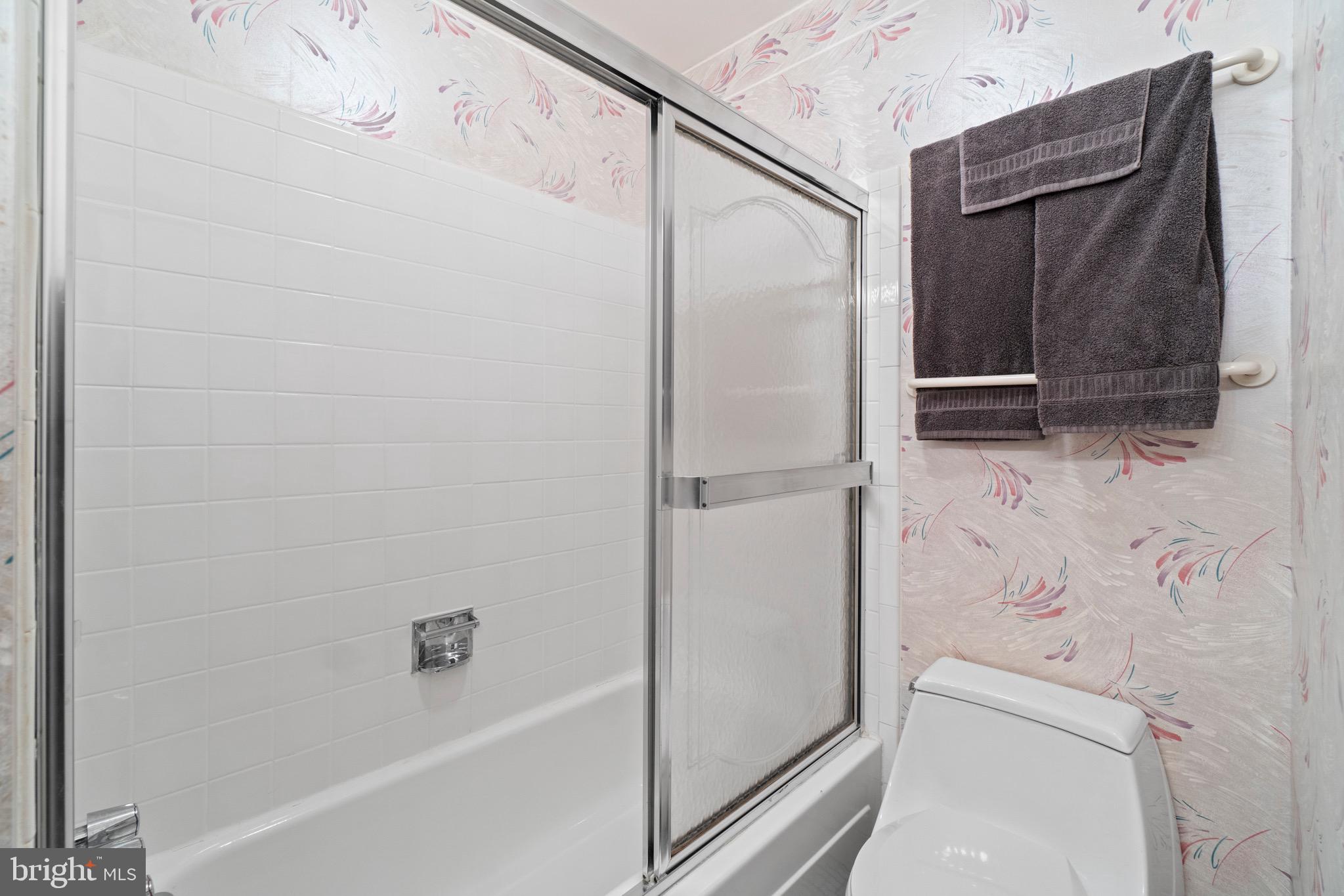 11318 Myrtle Lane Reston, VA 20191 - Photo 21 of 40 a bathroom with a bathtub and a shower