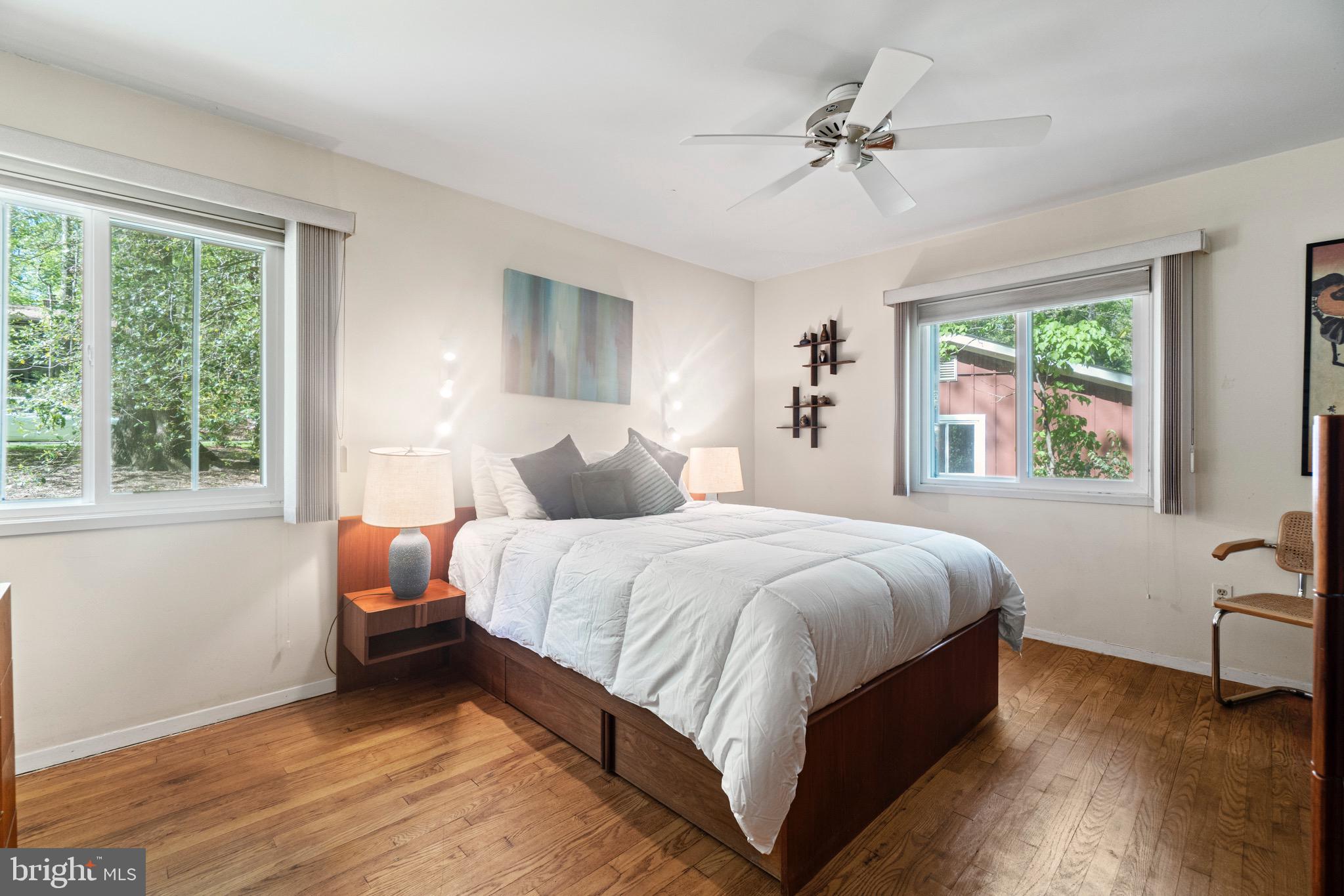 11318 Myrtle Lane Reston, VA 20191 - Photo 24 of 40 a bedroom with bed and a large window