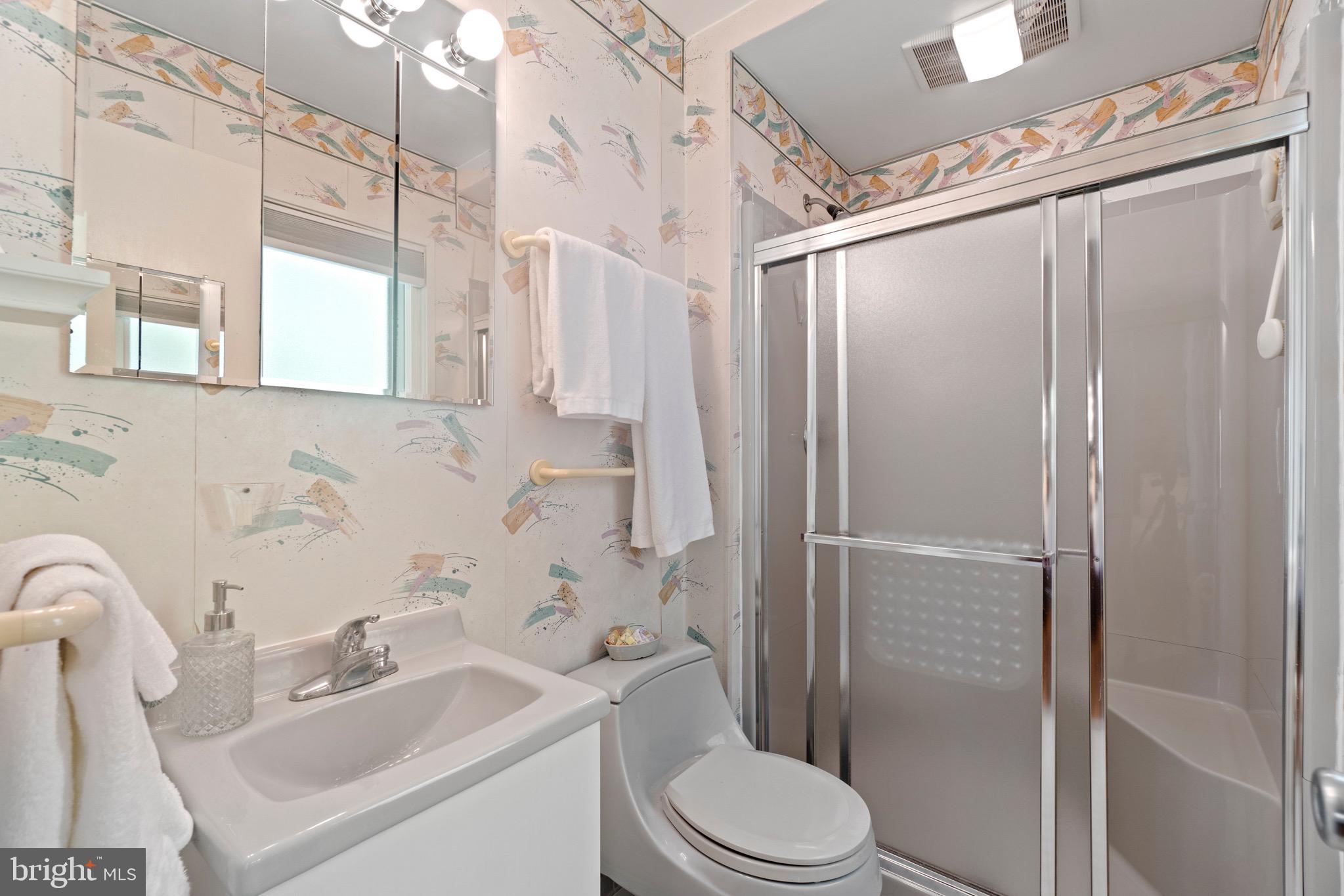11318 Myrtle Lane Reston, VA 20191 - Photo 26 of 40 a bathroom with a sink toilet and shower