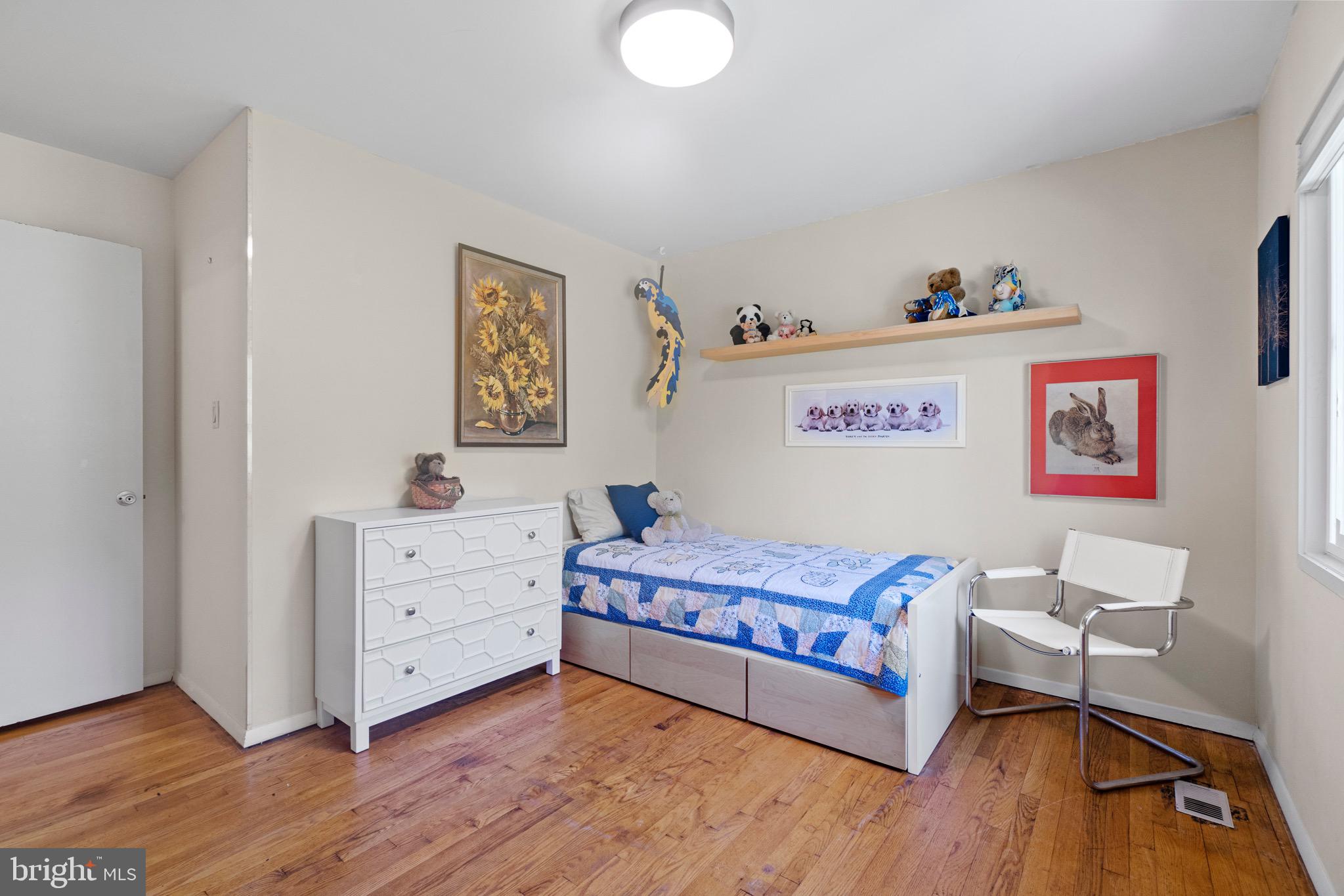 11318 Myrtle Lane Reston, VA 20191 - Photo 28 of 40 a bedroom with a bed and a dresser