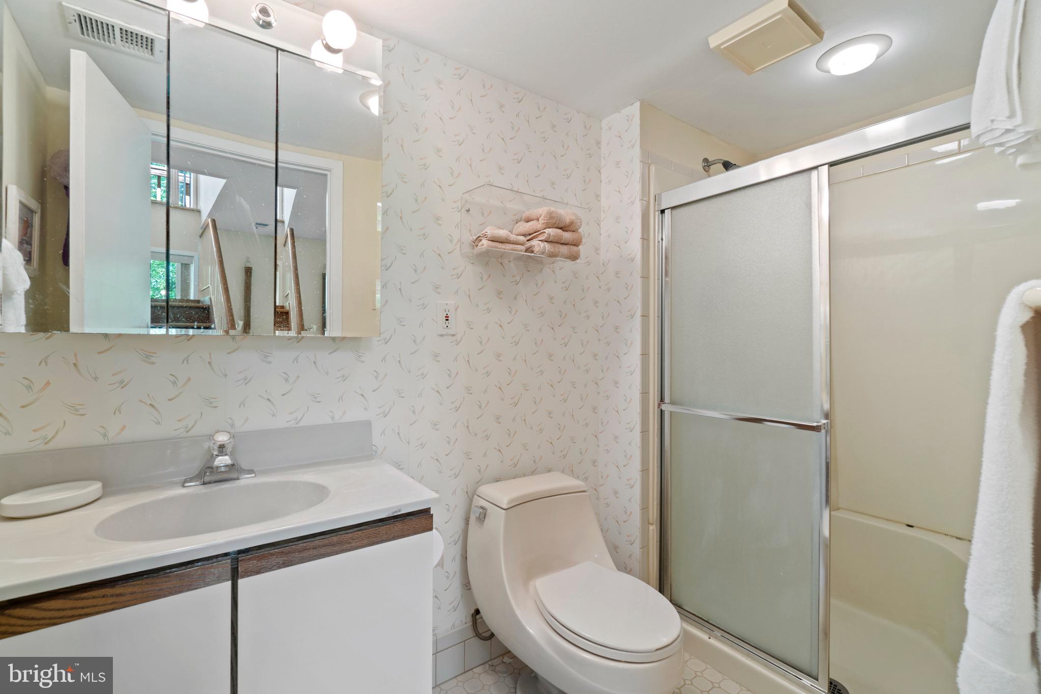 11318 Myrtle Lane Reston, VA 20191 - Photo 29 of 40 a bathroom with a sink toilet and shower