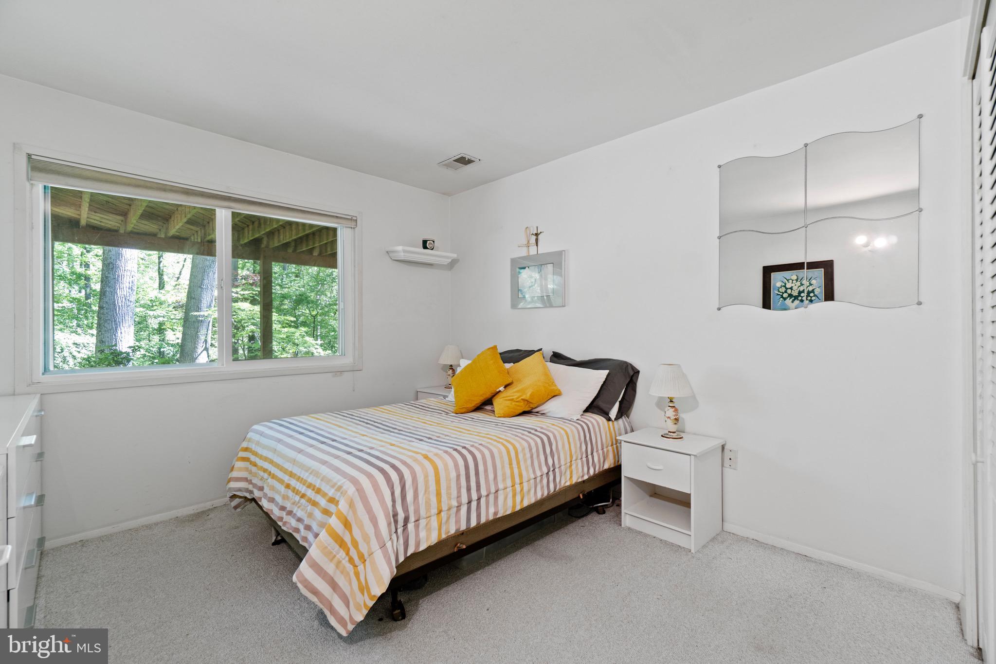 11318 Myrtle Lane Reston, VA 20191 - Photo 30 of 40 a bedroom with a bed and window