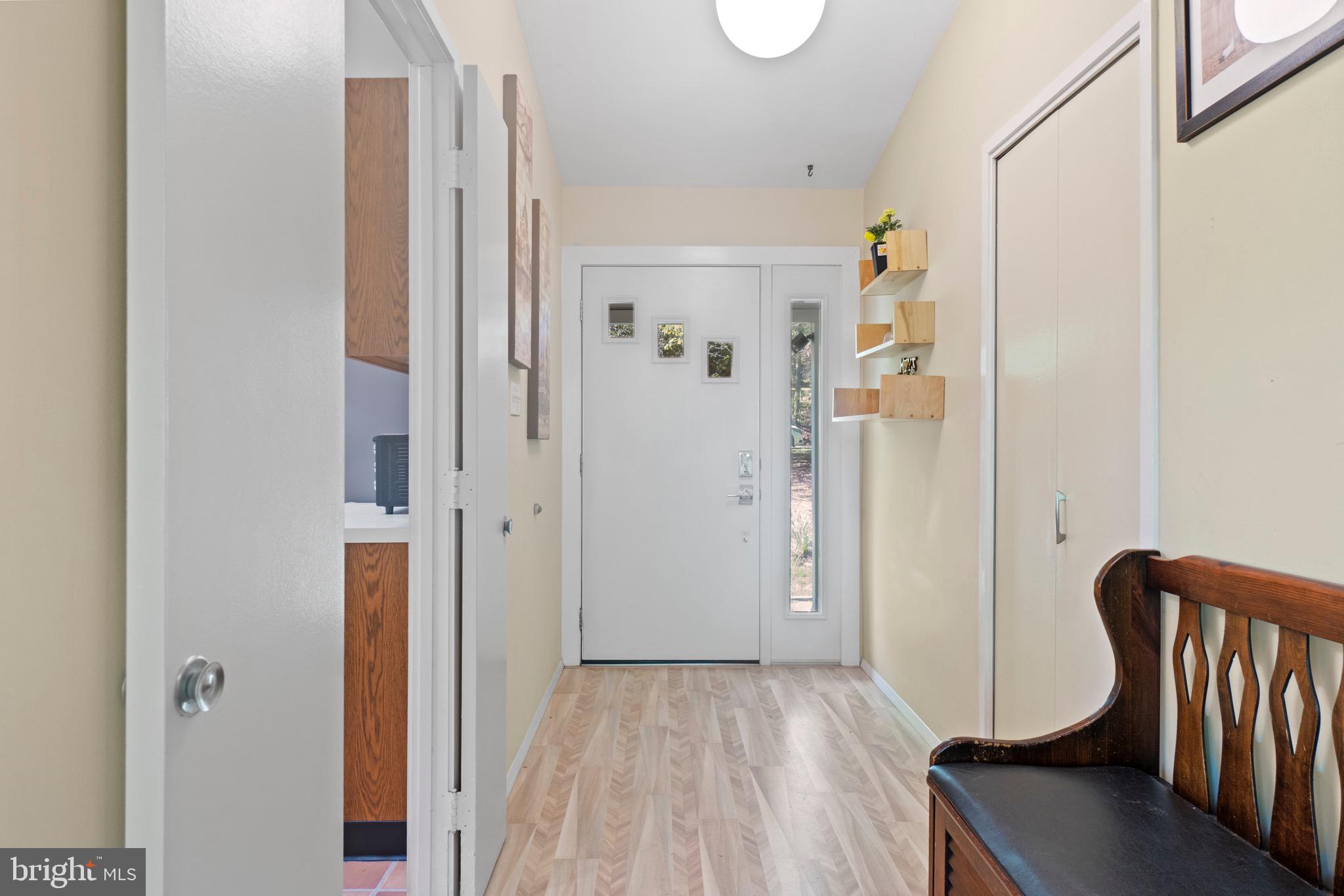 11318 Myrtle Lane Reston, VA 20191 - Photo 3 of 40 a view of a hallway with wooden floor and entryway