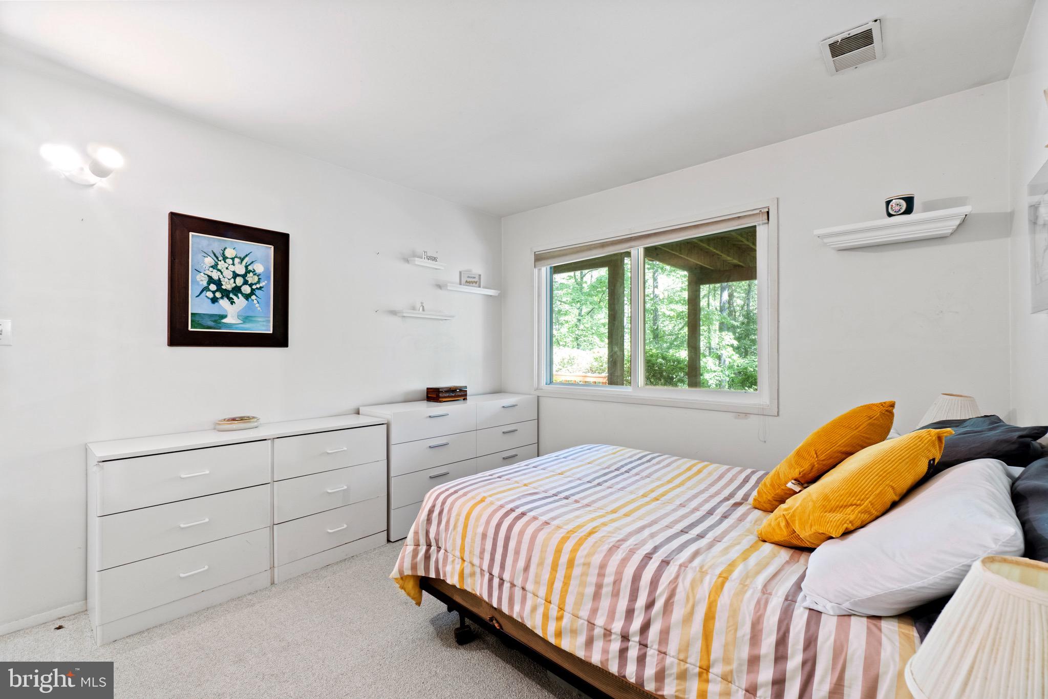 11318 Myrtle Lane Reston, VA 20191 - Photo 31 of 40 a bedroom with a bed and a window