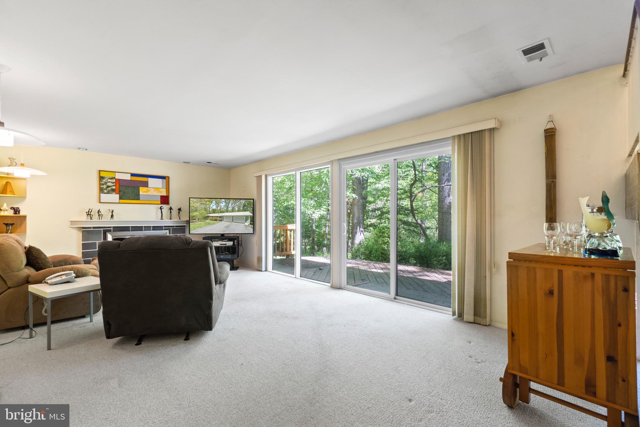 11318 Myrtle Lane Reston, VA 20191 - Photo 35 of 40 a living room with furniture and large windows