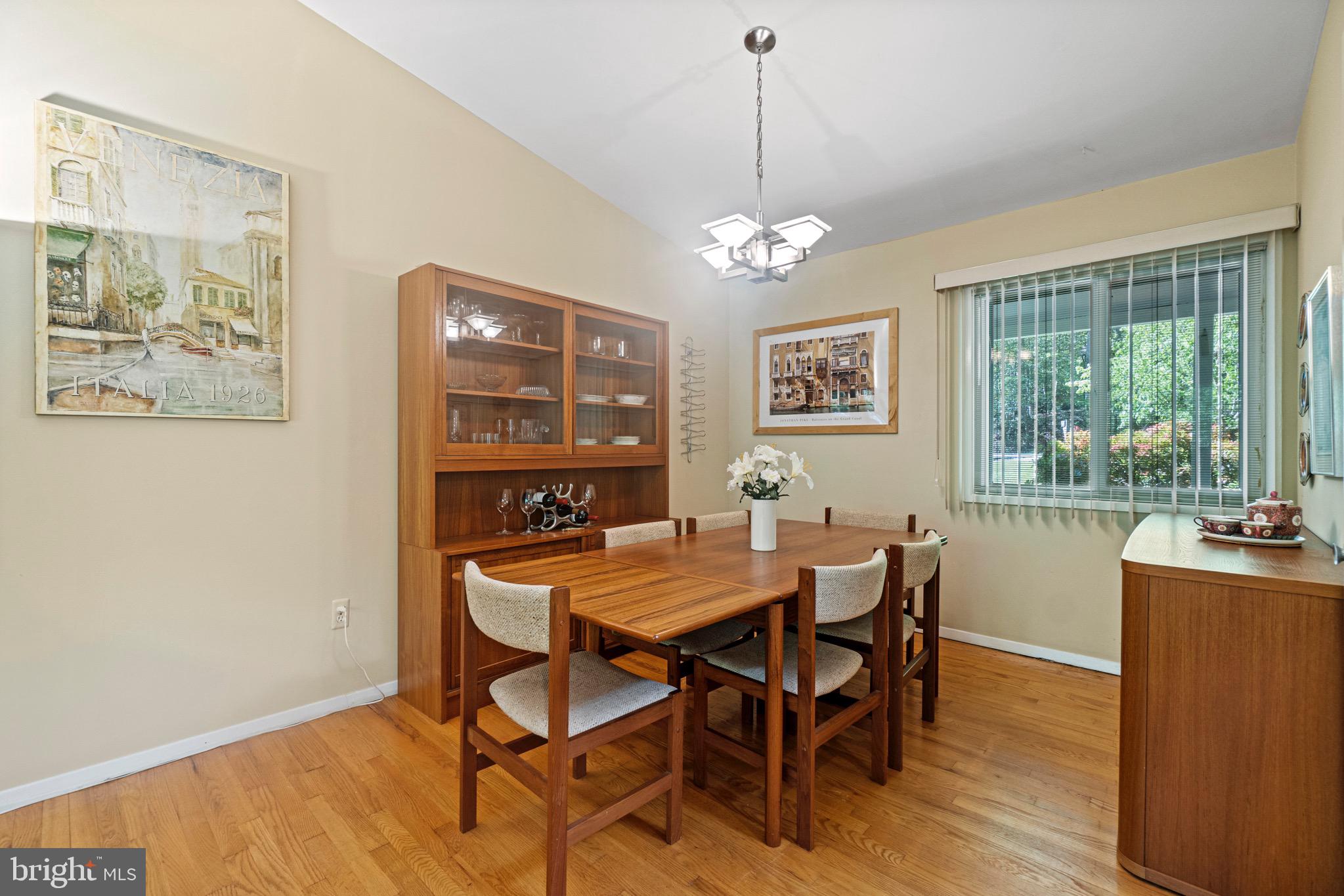 11318 Myrtle Lane Reston, VA 20191 - Photo 10 of 40 a view of a dining room with furniture window and wooden floor