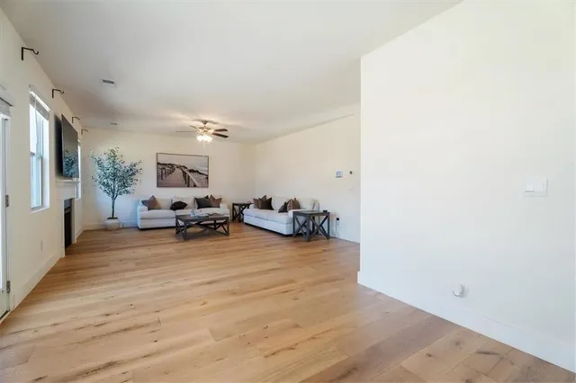 a view of a livingroom with furniture and a workspace