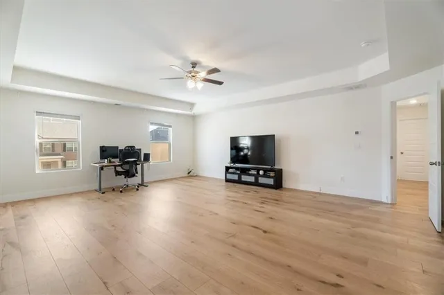 a view of a livingroom with furniture and a flat screen tv