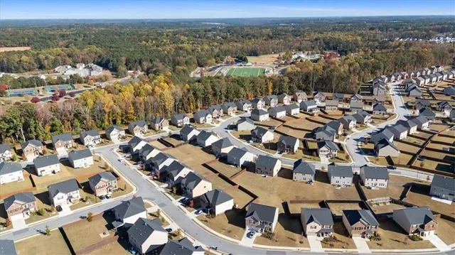 an aerial view of residential houses with outdoor space