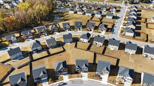 an aerial view of a building with parking