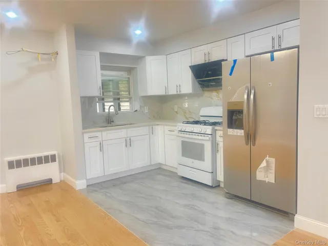 $1,099,000 | 140-14 68th Drive | Kew Gardens Hills