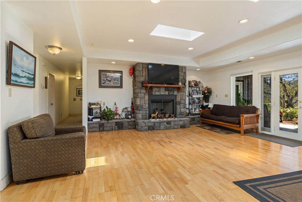 7875 Adobe Creek Road Kelseyville, CA 95451 - Photo 11 of 51 a living room with furniture and a flat screen tv