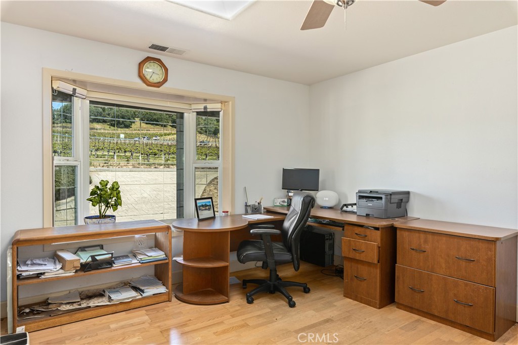 7875 Adobe Creek Road Kelseyville, CA 95451 - Photo 15 of 51 a view of a workspace with furniture and a window