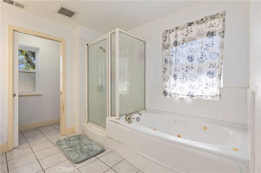 7875 Adobe Creek Road Kelseyville, CA 95451 - Photo 19 of 51 a bathroom with a bathtub and a shower