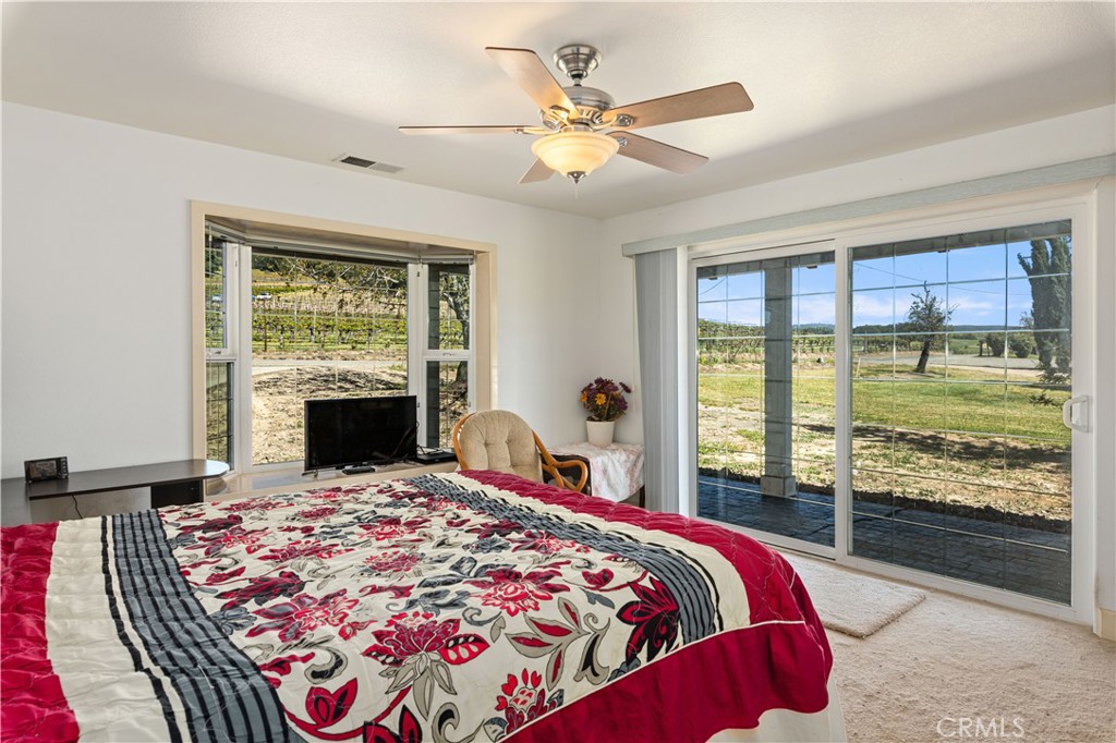 7875 Adobe Creek Road Kelseyville, CA 95451 - Photo 22 of 51 a bed sitting in a bedroom next to a window