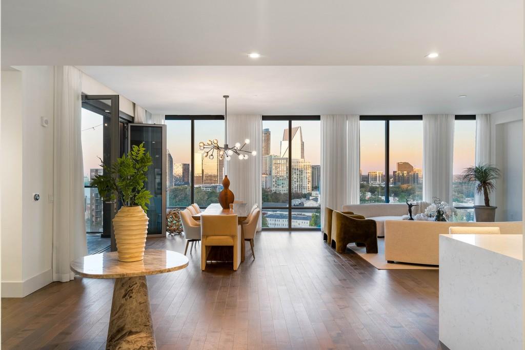 3107 Peachtree Road Northeast, Unit 1502 Atlanta, GA 30305 - Photo 1 of 1 a living room with furniture and a large window