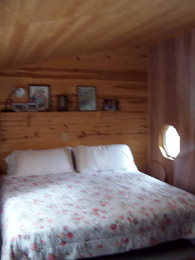 289 Old Pond Road Becket, MA 01223 - Photo 6 of 6 a bedroom with a bed and a lamp