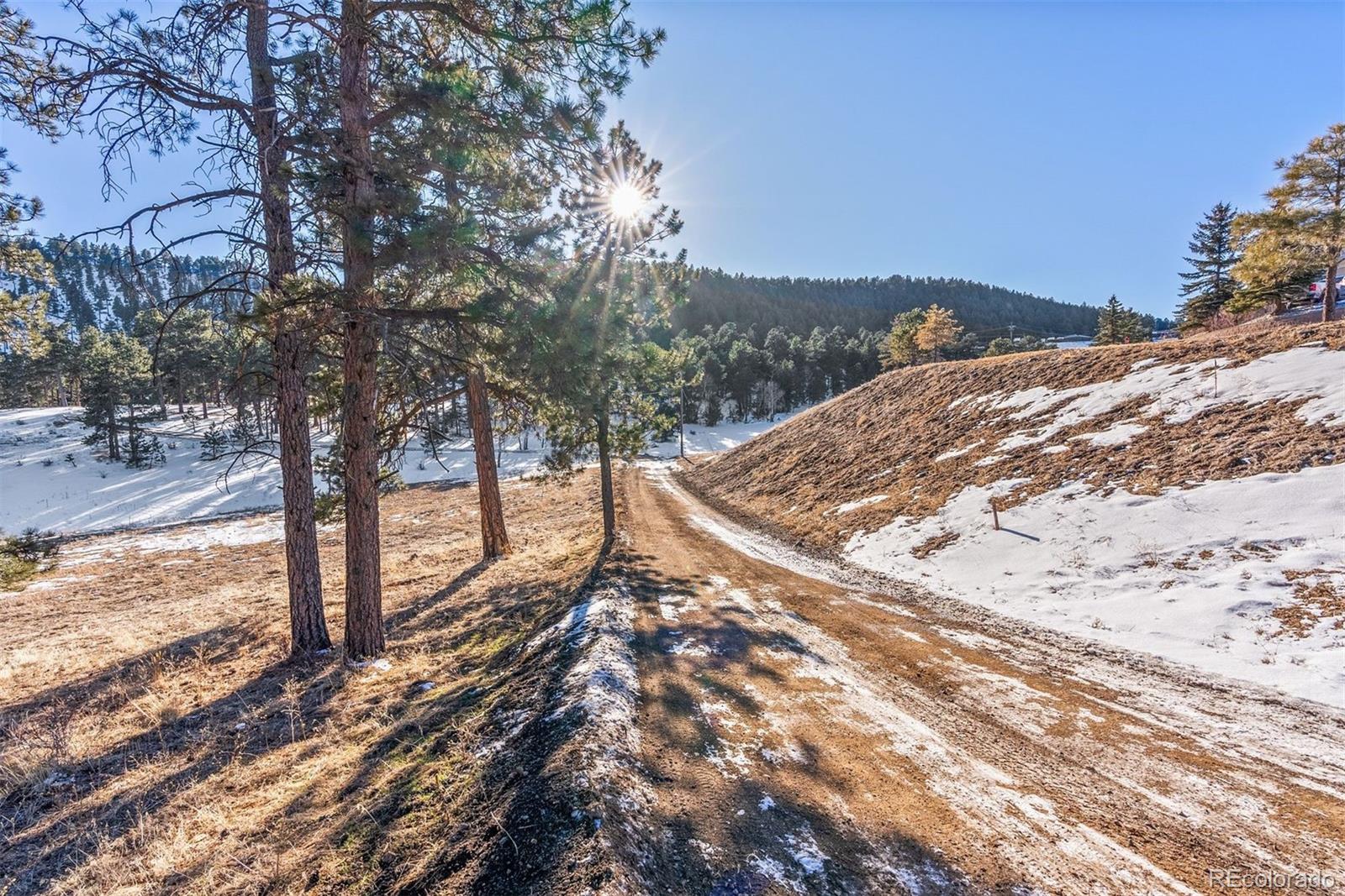Hotel Way Evergreen, CO 80439 - Photo 17 of 50 a view of a snow on the side of the road