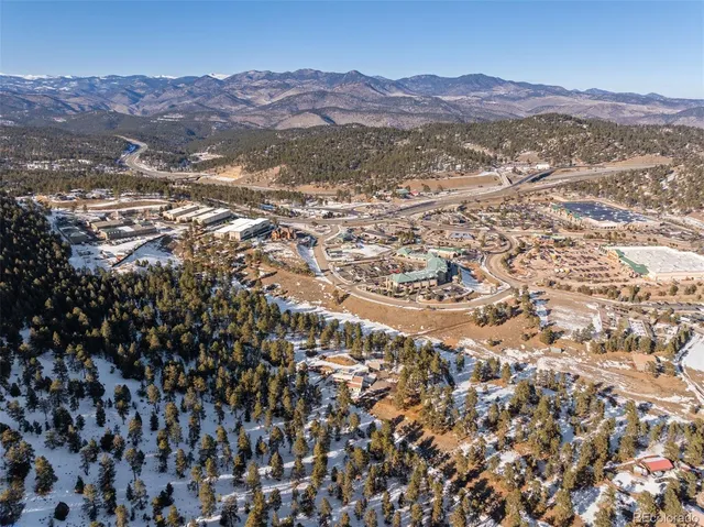 an aerial view of residential house and green space