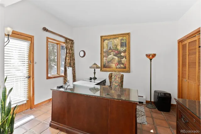 a spacious bathroom with a granite countertop sink mirror and bathtub