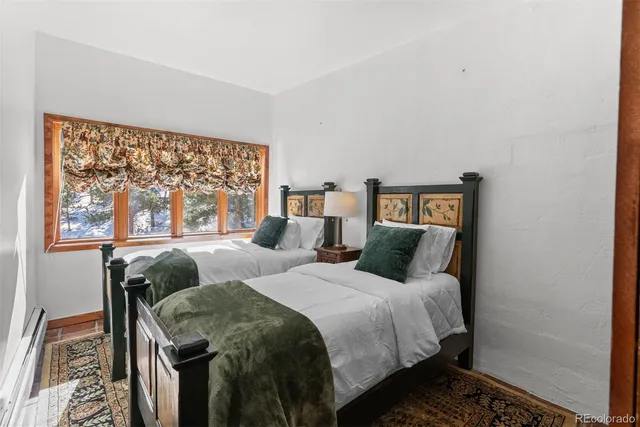 a view of bathroom with a sink mirror and shower
