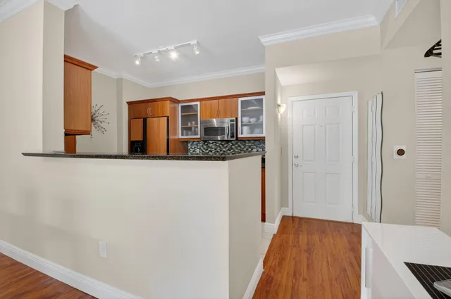 a kitchen with stainless steel appliances granite countertop a stove and a microwave