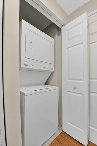 a view of a chair and tables in the balcony