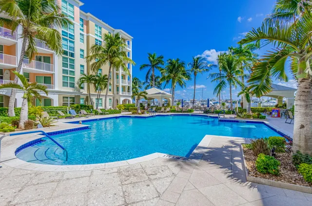 a view of a chairs and table in backyard