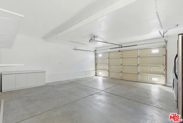 a view of a storage & utility room with washer and dryer