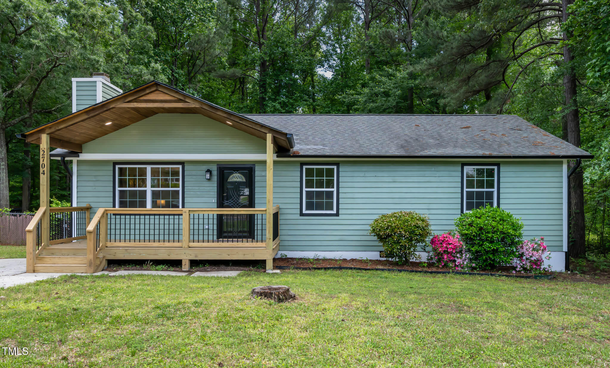 2704 Ross Road Durham, NC 27703 - Photo 1 of 28 a front view of a house with a garden