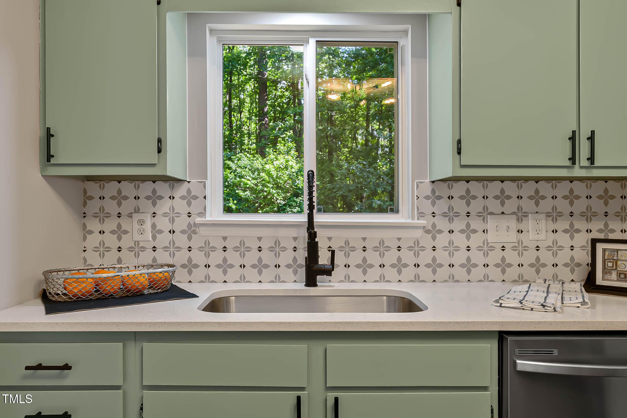 2704 Ross Road Durham, NC 27703 - Photo 11 of 28 a bathroom with a sink and a window