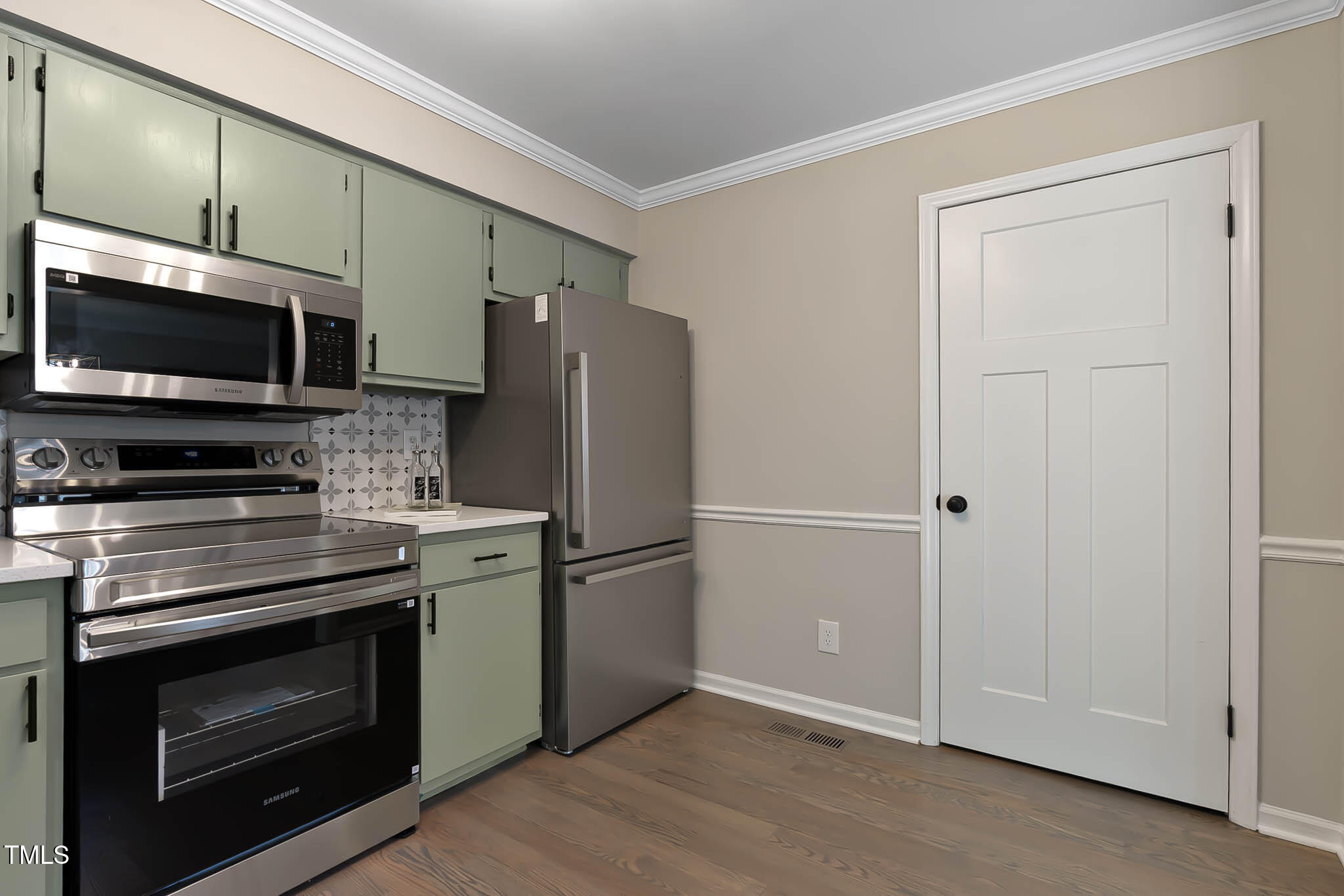 2704 Ross Road Durham, NC 27703 - Photo 13 of 28 a kitchen with stainless steel appliances a stove microwave and refrigerator